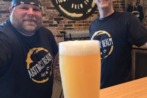 Jody Dzadovski (l.) and Abstract Realm's primary owner, Jason Short, with a freshly brewed Taniwha 6% ABV, a triple dry hopped extra pale ale made with New Zealand hops. (Photo: Rick Handler)