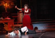 Tosca (Martínez) turns the tables on Baron Scarpia (Albertson) who must beg for his own miserable life.