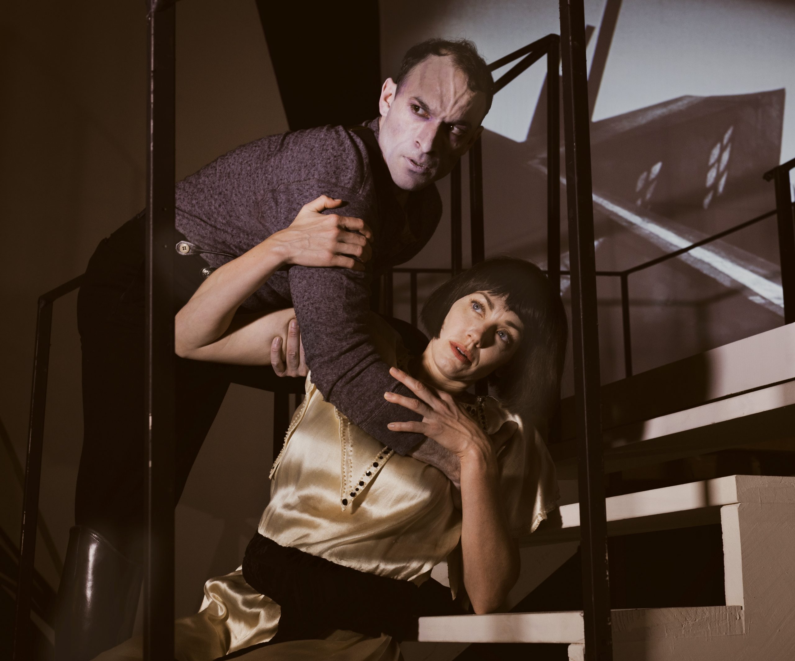 Just following orders? Cesare, Dr. Caligari's spellbound henchman, carries off Hannah to an uncertain fate in 'The Cabinet of Dr. Caligari.' The actors are Jerreme Rodriguez and Sara Lindsey.