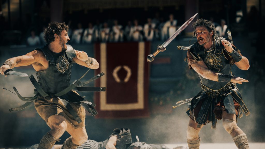 Some hot action as gladiators battle and swords are flying. Paul Mescal plays Lucius and Pedro Pascal plays Marcus Acacius.