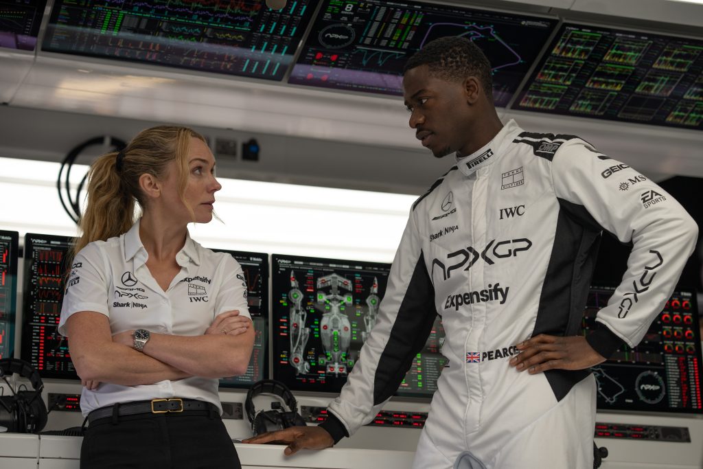 Kerry Condon as Kate, the technical director, and Damson Idris as Joshua Pearce, the hotshot rookie, in Apple Original Films’ “F1® The Movie,” a Warner Bros. Pictures release. Copyright: © 2025 Warner Bros. Entertainment Inc. All Rights Reserved. Photo by Scott Garfield  Courtesy Warner Bros. Pictures / Apple Original Films.