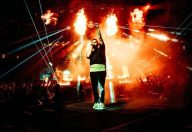 Brent Smith, Shinedown's lead singer, on the center platform with fire effects behind him. (Photo Credit: Carter Louthian, taken at MSG)
