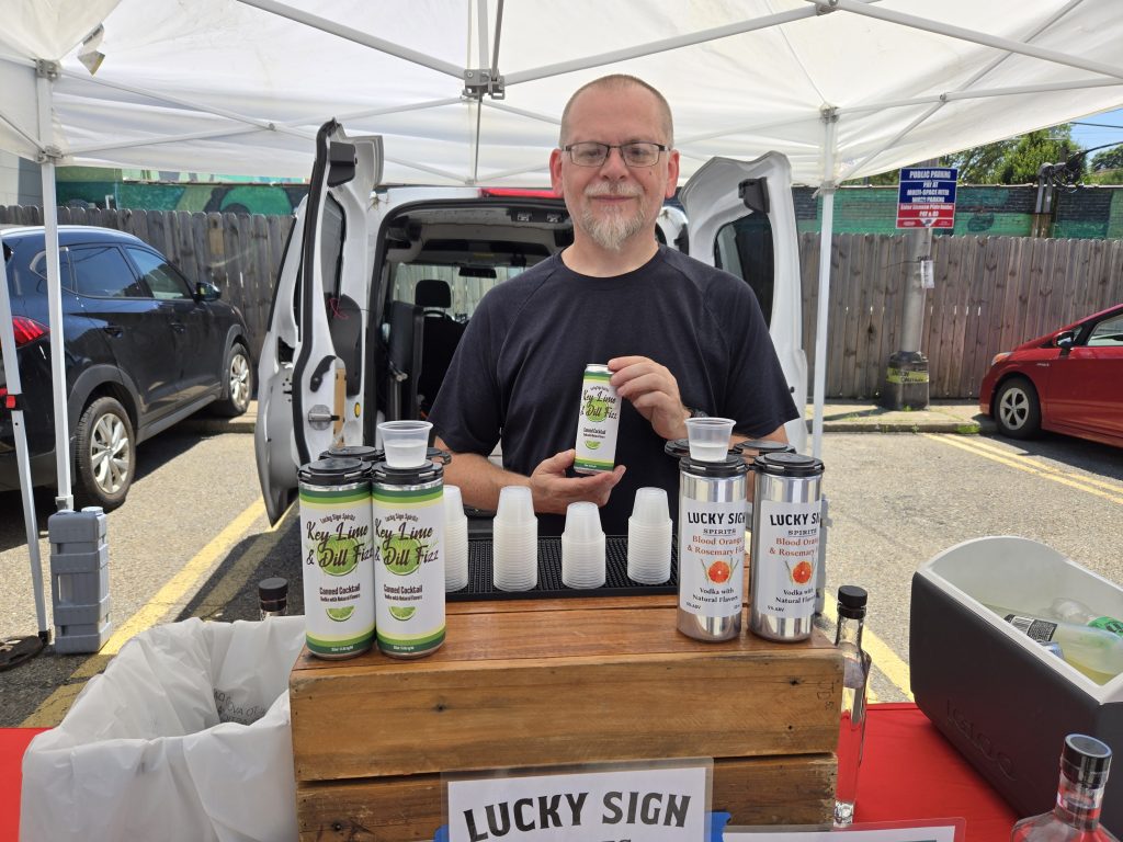Lucky Sign Spirits co-owner Christian Kahle and the Lucky Sign team offers tastings, and spirit sales, at many events, festivals, and farmers markets around town. (Photo by Rick Handler)