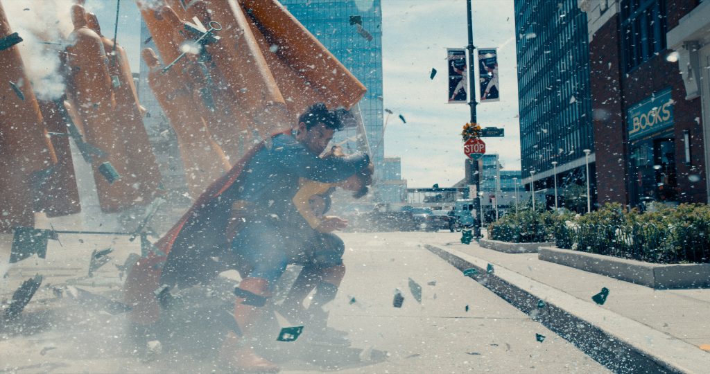 Ever vigilant in the wake of destruction, Superman (Cornswet) protects a small child. (And seconds later, he saves a squirrel!)