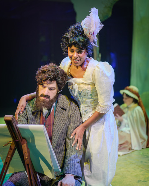 George Seurat (Aaron Galligan-Stierle) sketches as Dot (Saige Smith) encourages his creative vision of a Sunday scene in the park.