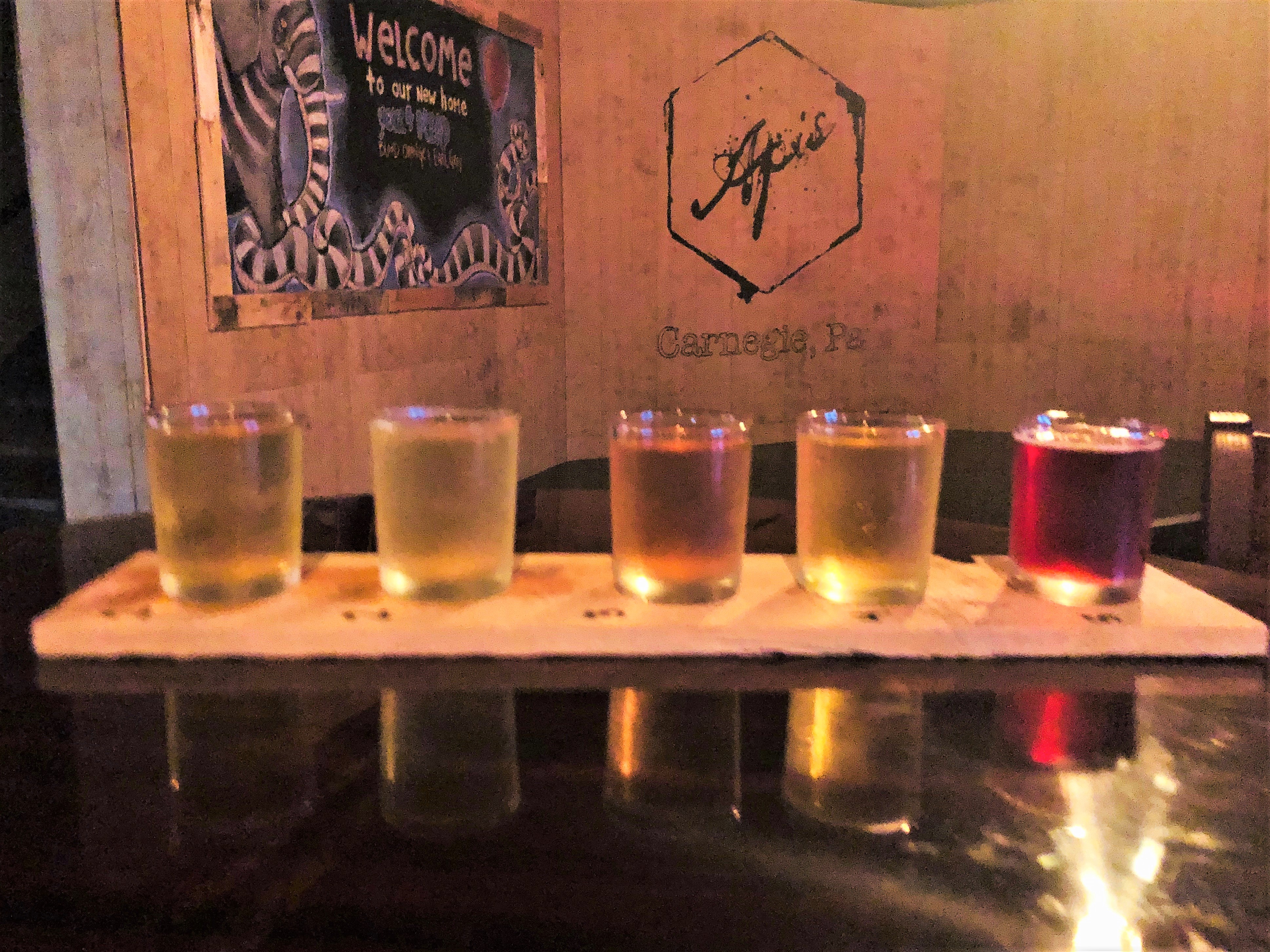 A flight of sweet Apis mead stands proudly before the new stage.