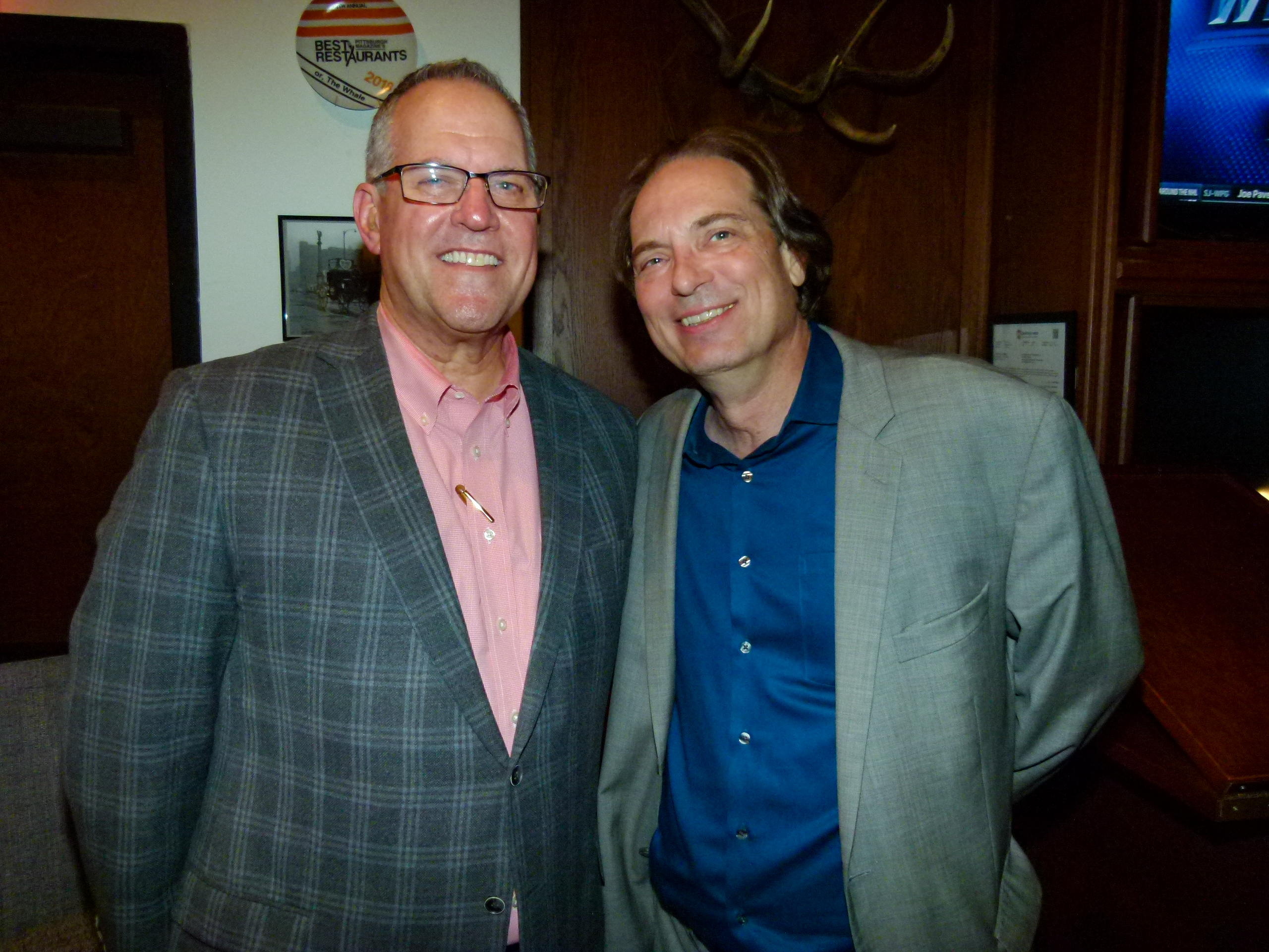 Mark De Intinis (Distrikt Hotel Pittsburgh GM) l., and Jim Graci (Program Director of NewsRadio 1020 KDKA and 93.7 The Fan) r.