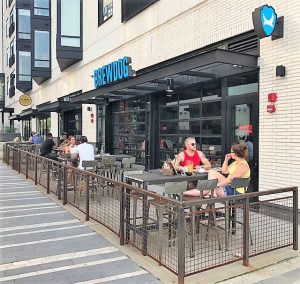 Patrons enjoy patio seating, which is also open for dogs.
