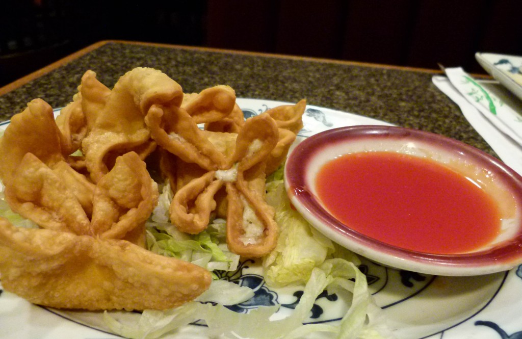 Crab Rangoon with dipping sauce.