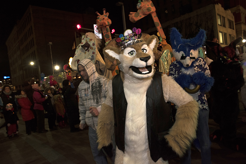 A Furry wishes onlookers a happy new year while marching in the 2015 First Night parade.