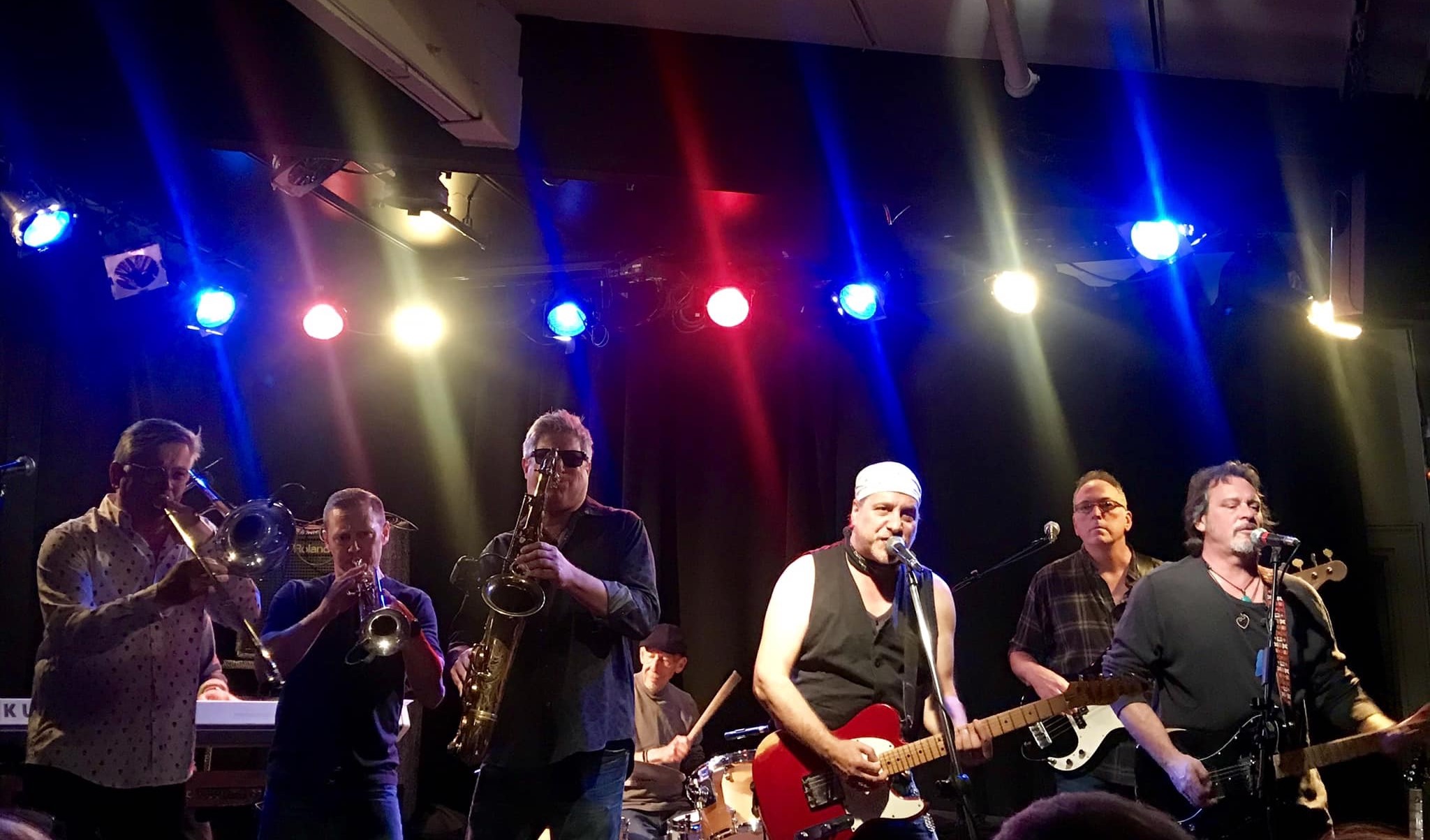 Bill Toms (center) and Hard Rain with The Soulville Horns performing at Club Cafe.