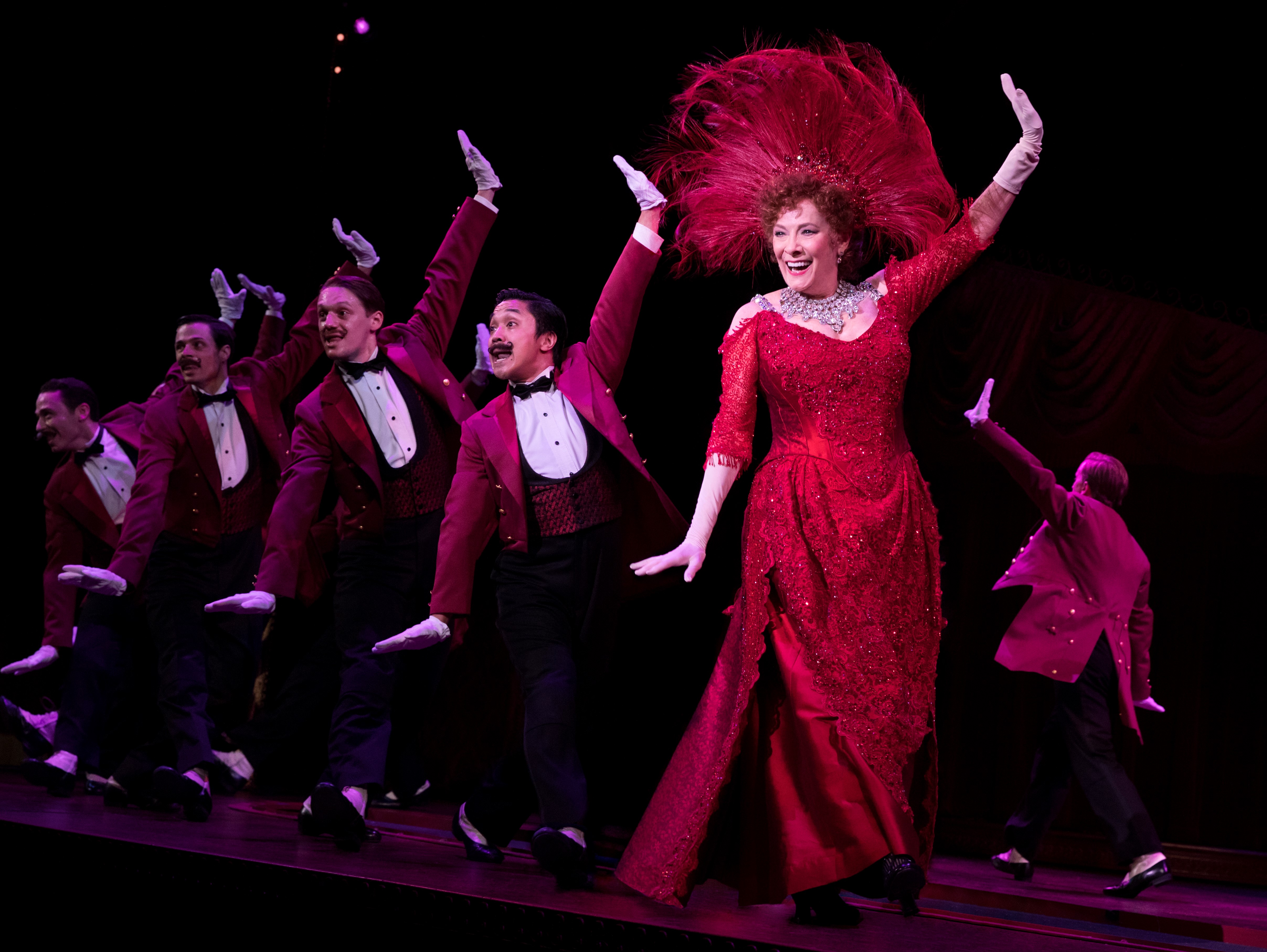 Dolly singing and dancing with the waiters in the "Hello Dolly!" number from the musical. Photo Credit: Julieta Cervantes