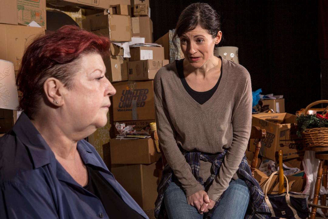Boxed in by the detritus of the past, two women seek a way forward in Lissa Brennan's 'Hoard.' Virginia Wall Gruenert, at left, plays the hoarder and Erika Cuenca is her visitor. (photo: Heather Mull)