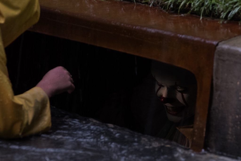In looking for his paper sailboat Georgie Denbrough (Jackson Robert Scott) sees Pennywise in the sewer.