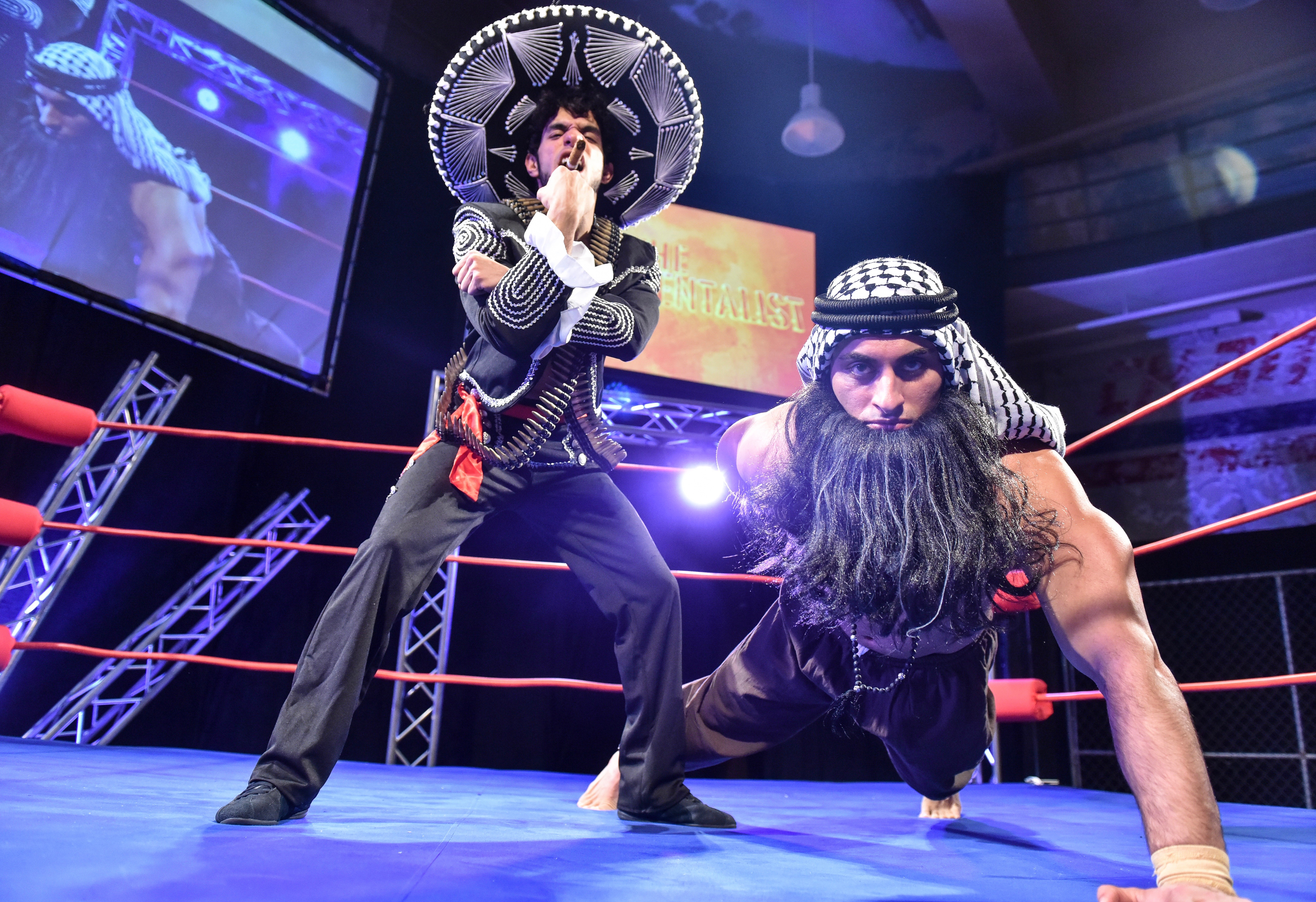 Better hurry up with that wall. When Ché Chavez Castro (Gil Perez-Abraham, L) dons his fightin' sombrero and The Fundamentalist (Nicola Slade) flexes the Mother of All Triceps, nothing can save us ... unless it's 'The Elaborate Entrance of Chad Deity.'