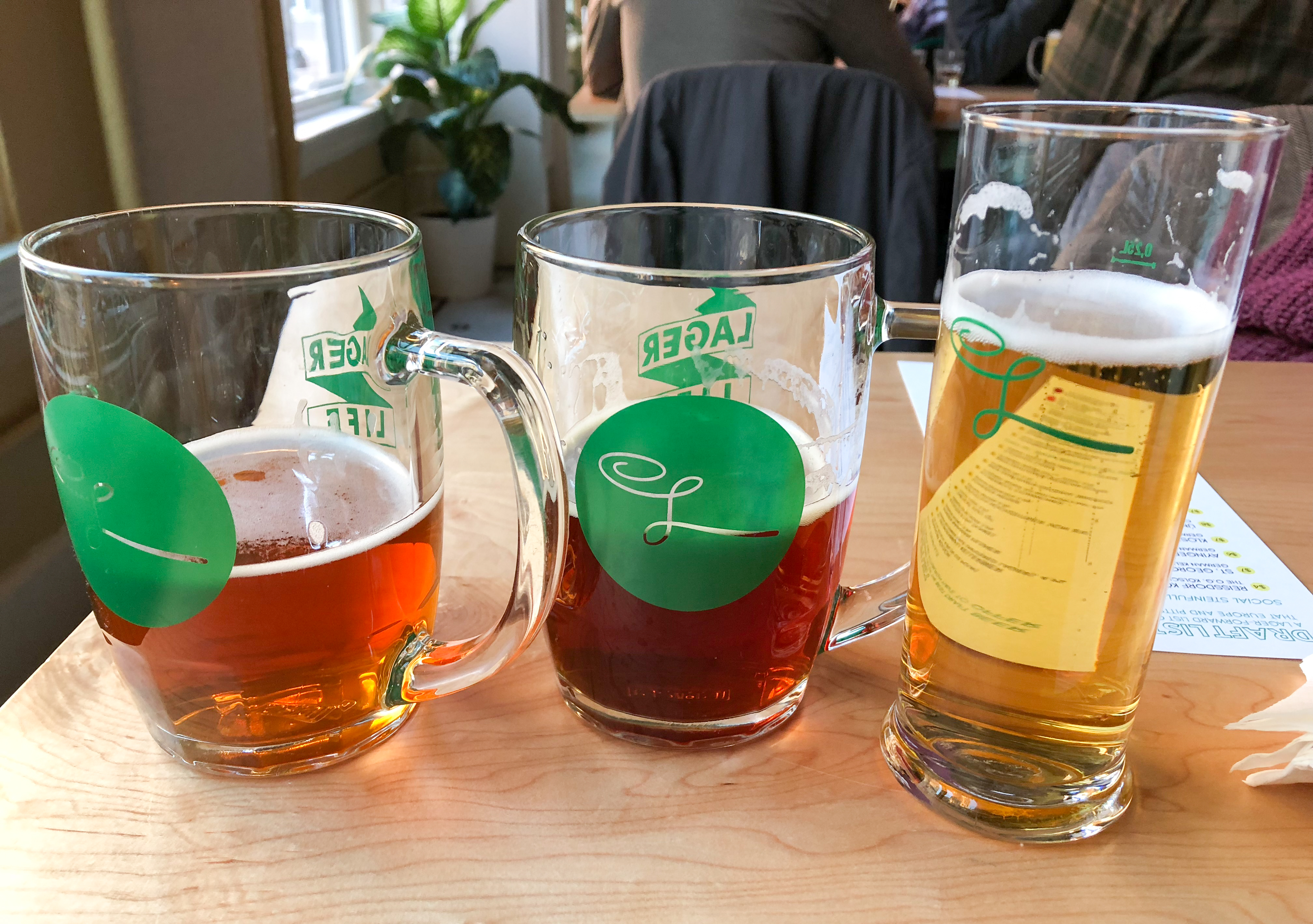 A trio of partially consumed beers, l. to r., the kellerbier, märzen, and kölsch.