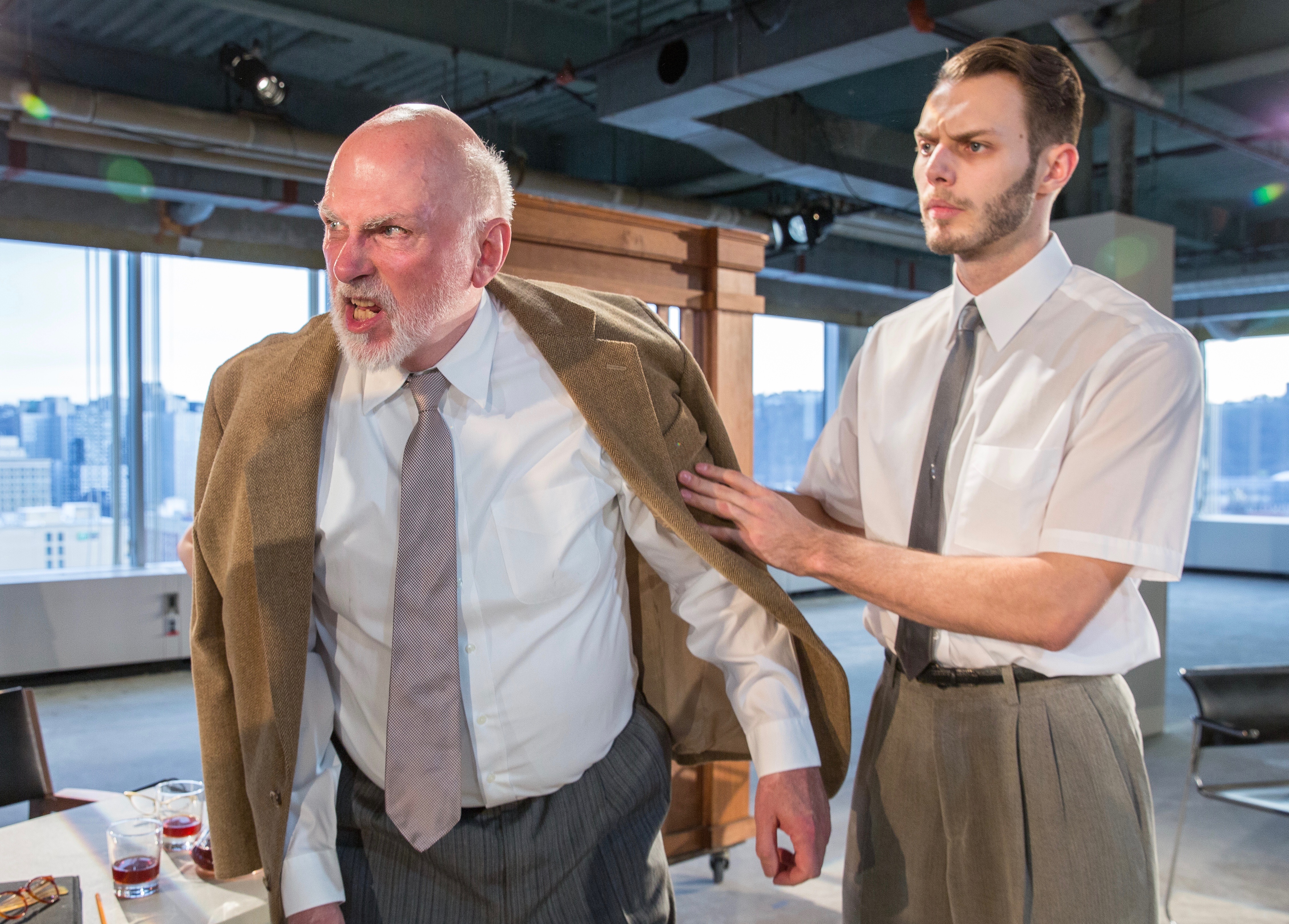 Old passions erupt in new form in Ibsen's "The Master Builder" at Quantum Theatre. Here, inflamed papa Knut Brovik (John Reilly, L) gets the chill-it handle from son Ragnar (Thomas Constantine Moore).