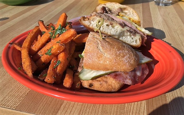 Sweet potato fries are one of two sides that can accompany sandwiches, like the Cubano.