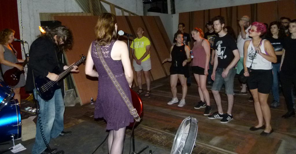 The crowd gets into Murder for Girl's power punk rock.
