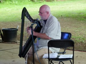 Dennis Doyle playing the harp.