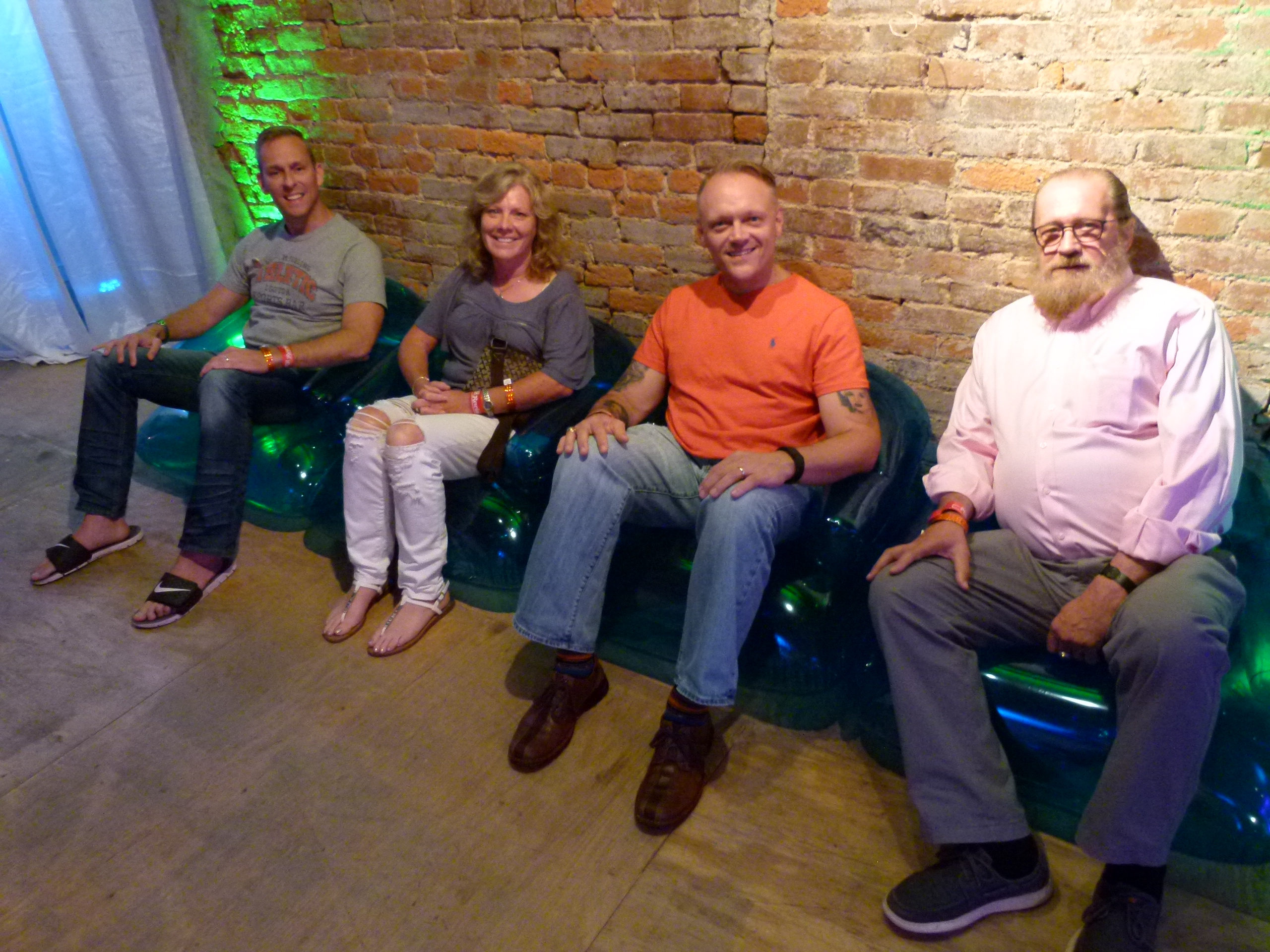Guests relaxing on blue bubble chairs: (l. to r.) Eric Horwith, Chris Schuette, John Komisary, and Dennis Wilson.
