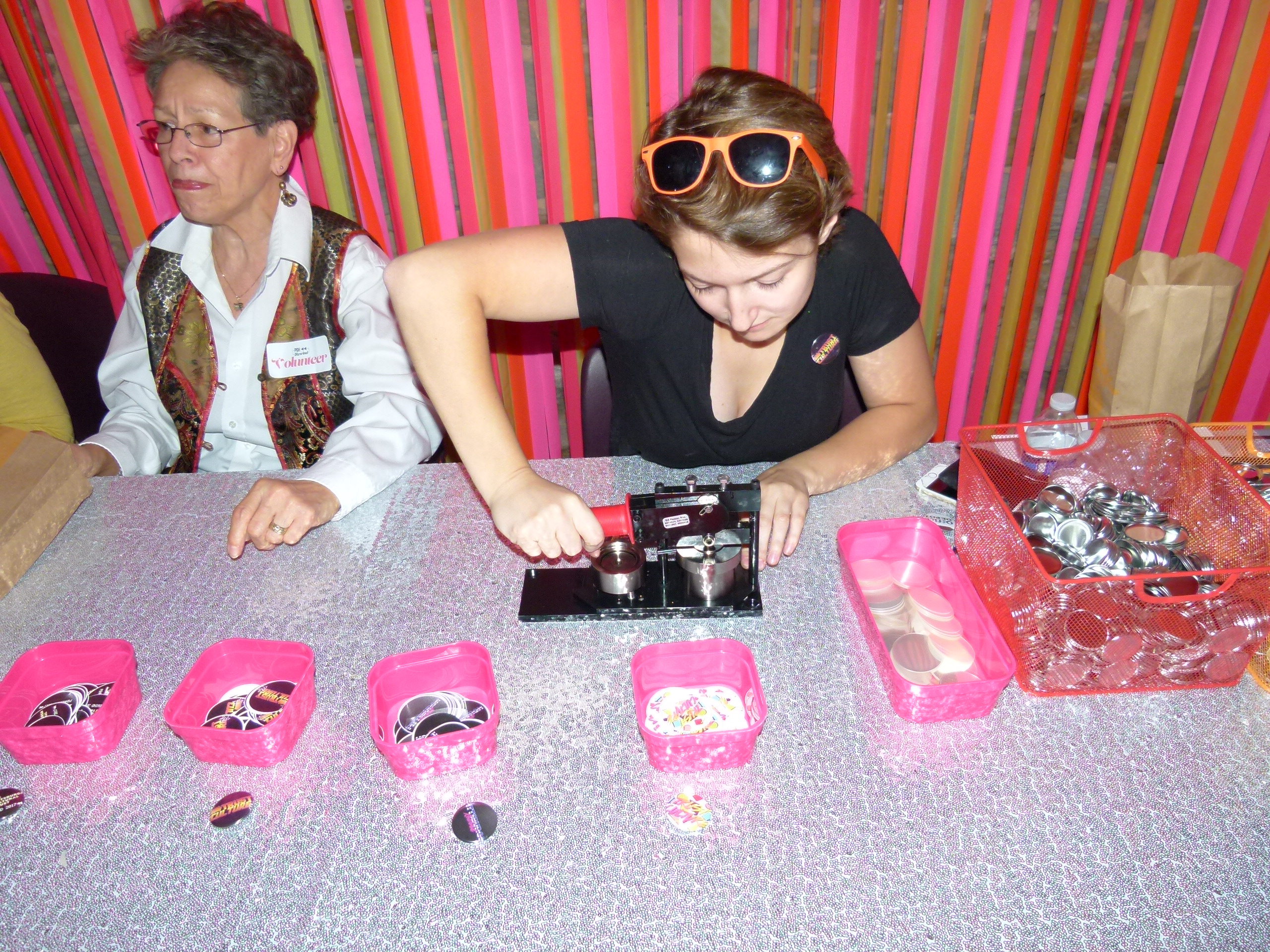 Megan Bresser making a button at the button-making station.