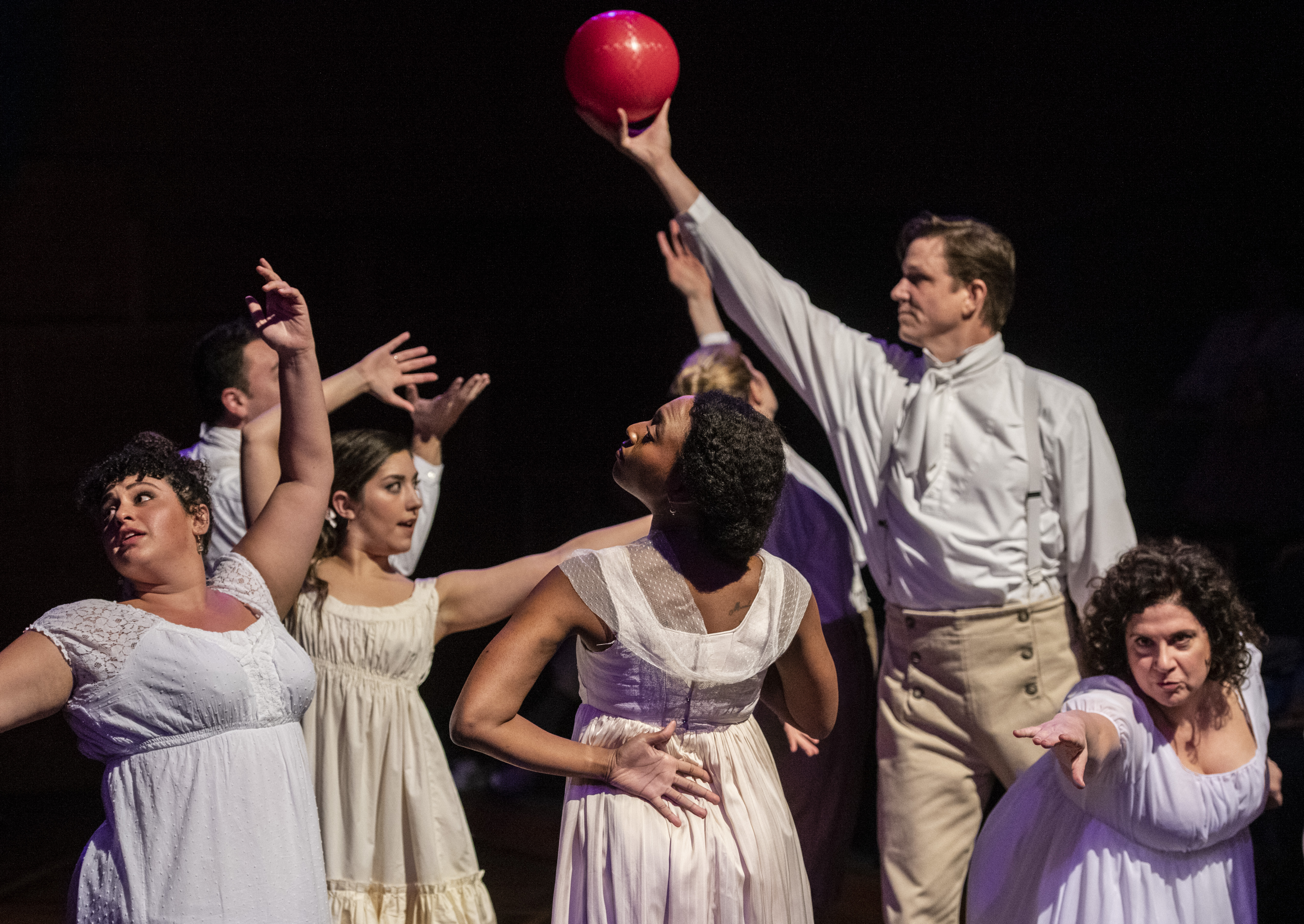 Actor Andrew William Smith proudly holds the red ball high in his role as sister Mary in the The Public's 'Pride and Prejudice,' and who knows what the others are up to? (Photo: Michael Henninger)