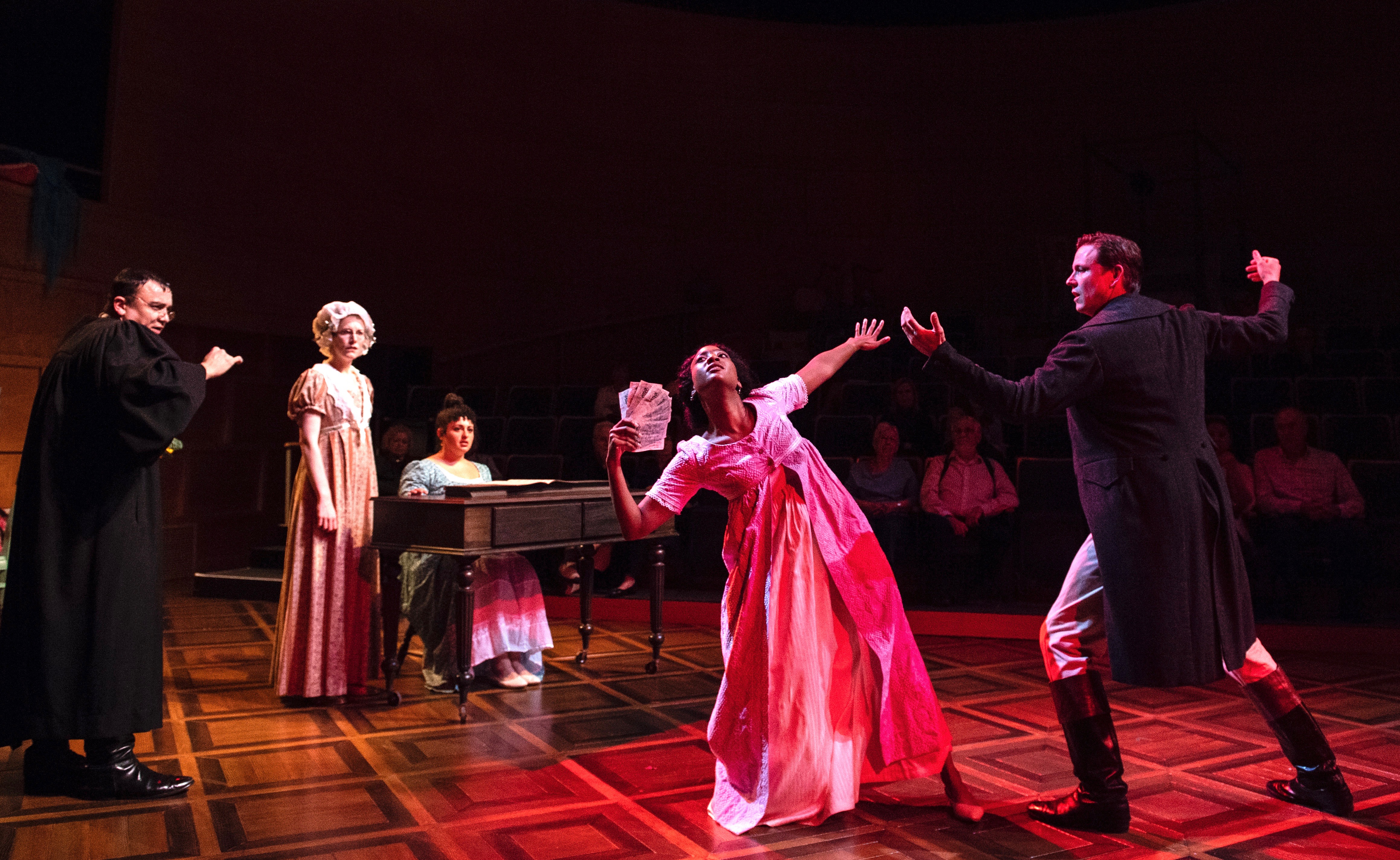 Beautiful Jane (Ashley Bufkin) busts a move with perfect gentleman Mr. Bingley (Andrew William Smith), as Collins (Chris Richards, left) cowers. Charlotte (Ashton Heyl) and Lizzie observe from a safe distance.