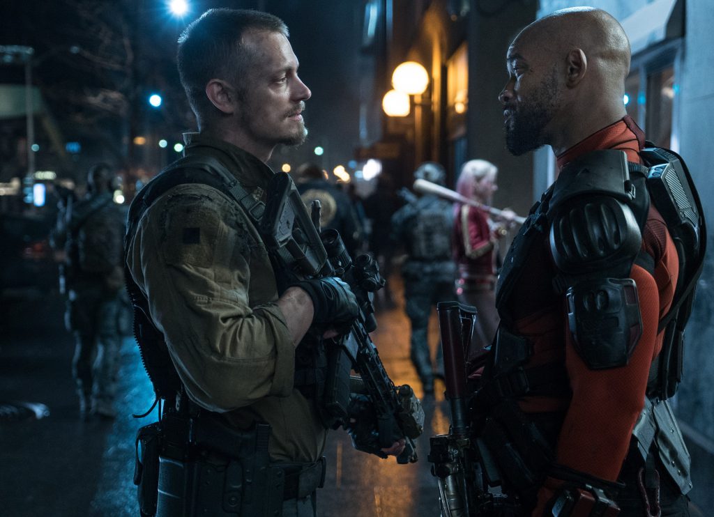 (L-r) Joel Kinnaman as Rick Flag and Will Smith as Deadshot have a little face-to-face chat. Photo Credit: Clay Enos/ TM & (c) DC Comics.