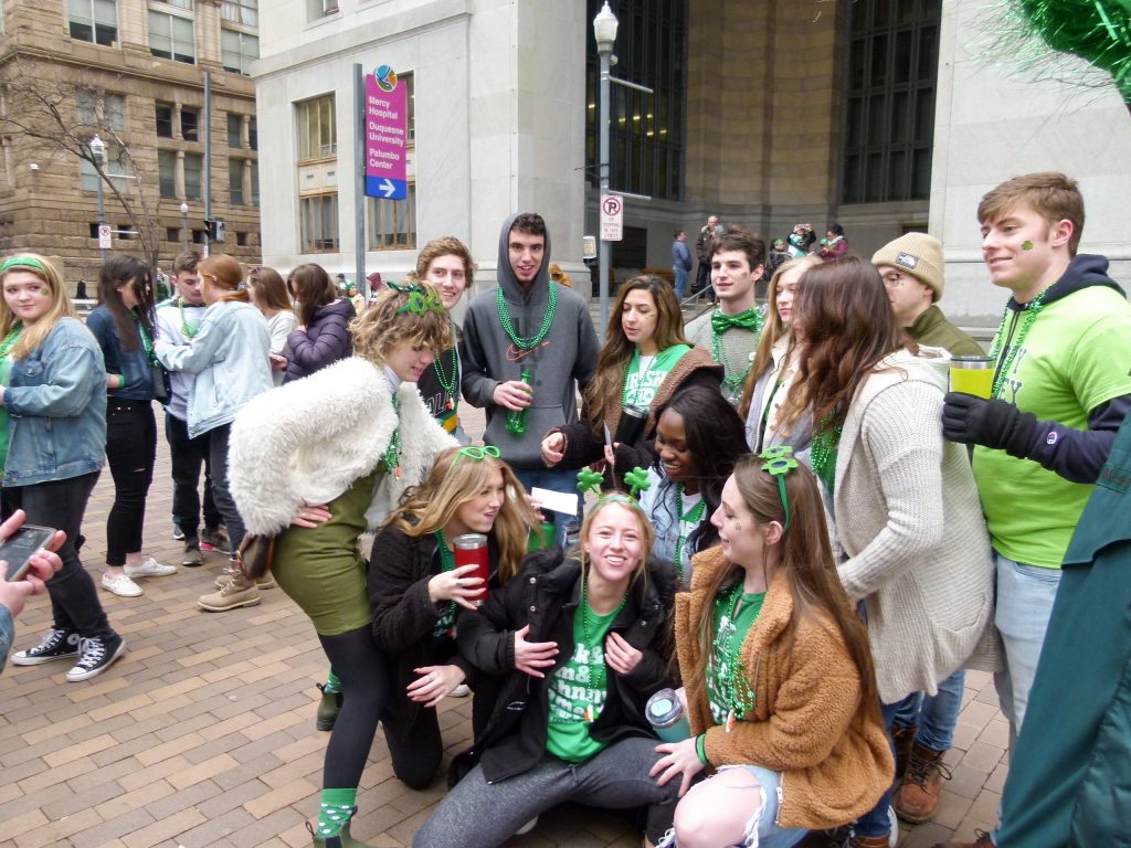 A group of friends having fun at the 2019 St. Patrick's Day Parade.