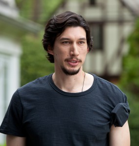 In a dressed-down moment, black sheep Phillip (Adam Driver) sports a simple black T with shoulder accessory.