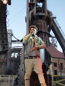 Ugly God is framed by the old (blast furnace) and new, (speakers tower) of the Carrie Furnaces site.