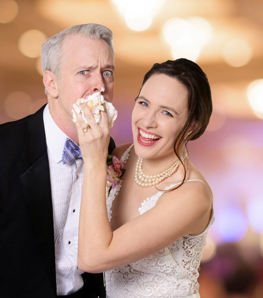 Baaad groom! Julia Geisler gives Tim McGeever a piece of her cake in CLO’s ‘Perfect Wedding.’