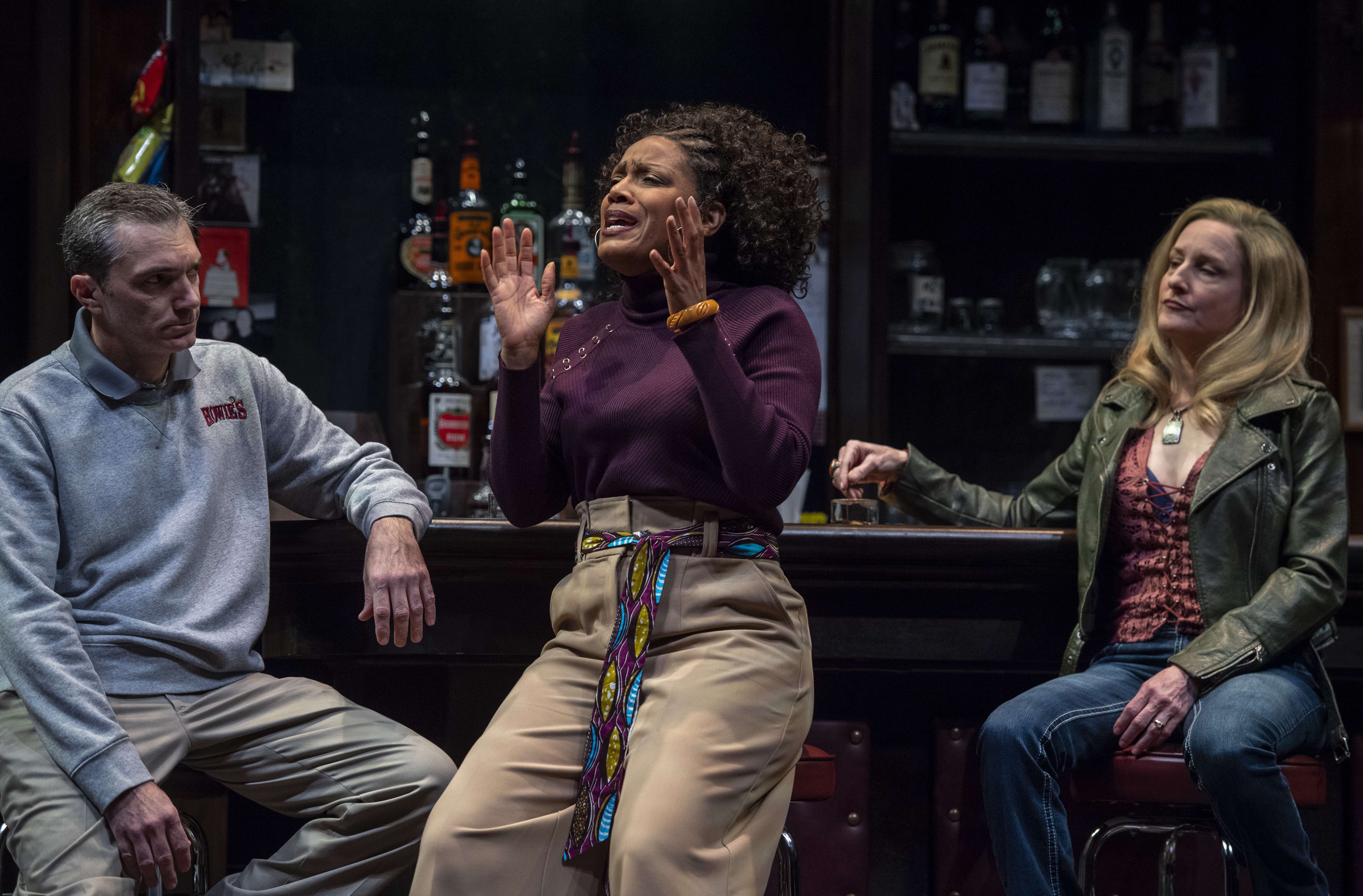 Blue-sky visions vs. blue-collar realities: Cynthia (Tracey Conyer Lee, center) expounds on the situation while Stan (Tony Bingham) and Tracey (Amy Landis) listen in 'Sweat.' Photo: courtesy of Pittsburgh Public Theater.