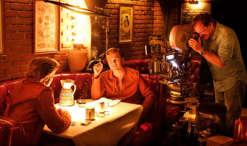 Quentin Tarantino lining up a shot of Leonardo DiCaprio and Brad Pitt on the set of 'Once Upon a Time in Hollywood.' (photo: Andrew Cooper, © 2019 CTMG, Inc.)