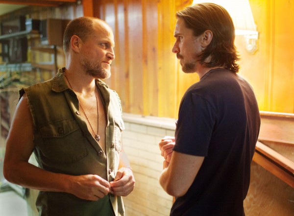 Harlan DeGroat (Woody Harrelson, left) has a problem.  Russell Baze (Christian Bale) wants to hear it. Despite this touching concern, bromance is not in the cards, and the repercussions that follow raise some interesting questions for the audience.  