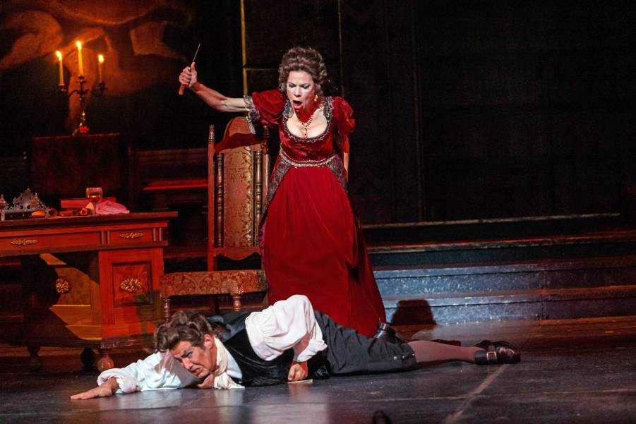 Tosca (Martínez) turns the tables on Baron Scarpia (Albertson) who must beg for his own miserable life.