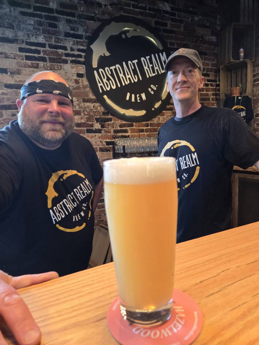 Jody Dzadovski (l.) and Abstract Realm's primary owner, Jason Short, with a freshly brewed Taniwha 6% ABV, a triple dry hopped extra pale ale made with New Zealand hops. (Photo: Rick Handler)