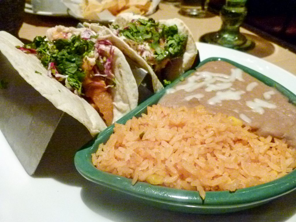 Ensenada fish tacos with refried beans and fiesta rice.