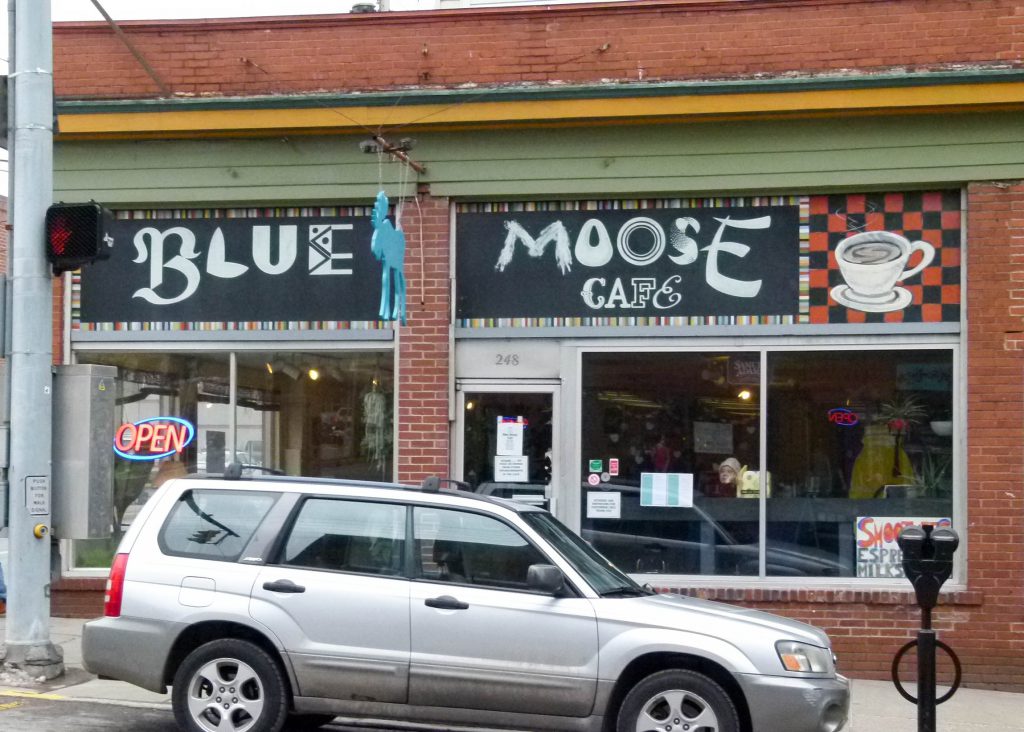 The fun and folksy exterior of Blue Moose Cafe in downtown Morgantown. The blue wooden cutout hanging in the center of the photo is, what else, a Blue Moose.